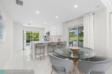 Discover this beautifully updated South Florida home in sunny on Boca Greens Country Club in Florida - for sale on GolfHomes.com, golf home, golf lot