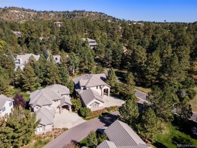 Discover luxury, convenience, and serenity in this stunning home on Country Club at Castle Pines in Colorado - for sale on GolfHomes.com, golf home, golf lot