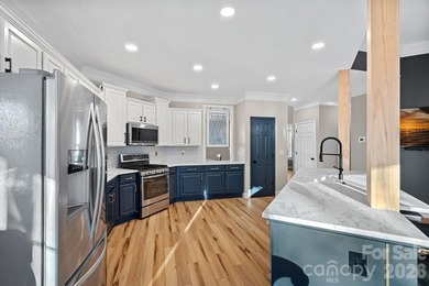 Poised on the golf course in one of Denver's most admired on Verdict Ridge Golf and Country Club in North Carolina - for sale on GolfHomes.com, golf home, golf lot