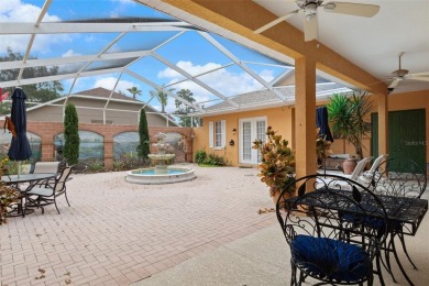 Stunning Custom-Built Palmwood Courtyard Home Nestled In The on Silverthorn Country Club in Florida - for sale on GolfHomes.com, golf home, golf lot
