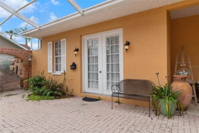 Stunning Custom-Built Palmwood Courtyard Home Nestled In The on Silverthorn Country Club in Florida - for sale on GolfHomes.com, golf home, golf lot