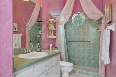 Stunning Custom-Built Palmwood Courtyard Home Nestled In The on Silverthorn Country Club in Florida - for sale on GolfHomes.com, golf home, golf lot