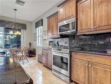 This home has a brand-New Roof! Stunning Panoramic Lake & Golf on Pelican Preserve Golf Club in Florida - for sale on GolfHomes.com, golf home, golf lot