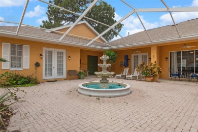 Stunning Custom-Built Palmwood Courtyard Home Nestled In The on Silverthorn Country Club in Florida - for sale on GolfHomes.com, golf home, golf lot