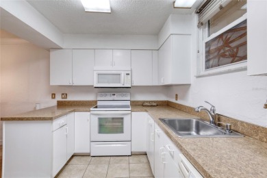 Enjoy easy living in this beautifully furnished 2-bedroom on Daytona Beach Golf Club in Florida - for sale on GolfHomes.com, golf home, golf lot