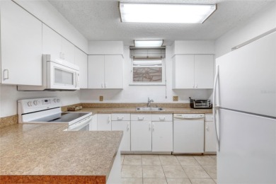 Enjoy easy living in this beautifully furnished 2-bedroom on Daytona Beach Golf Club in Florida - for sale on GolfHomes.com, golf home, golf lot