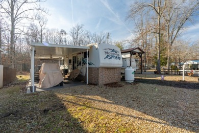 Nestled in the heart of Holiday Out RV Park, this charming on Lake Tansi Village Country Club in Tennessee - for sale on GolfHomes.com, golf home, golf lot