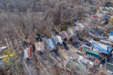 Nestled in the heart of Holiday Out RV Park, this charming on Lake Tansi Village Country Club in Tennessee - for sale on GolfHomes.com, golf home, golf lot