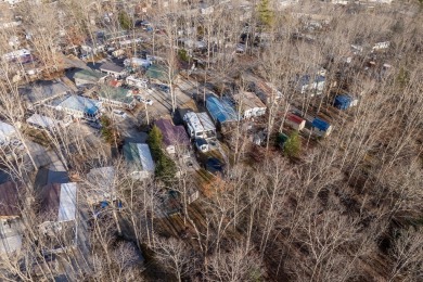 Nestled in the heart of Holiday Out RV Park, this charming on Lake Tansi Village Country Club in Tennessee - for sale on GolfHomes.com, golf home, golf lot