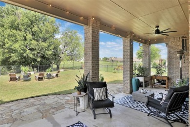 Elegant residence located at the first hole of the golf course on The Golf Club at Resort Eagle Mountain Lake in Texas - for sale on GolfHomes.com, golf home, golf lot