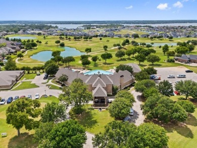 Elegant residence located at the first hole of the golf course on The Golf Club at Resort Eagle Mountain Lake in Texas - for sale on GolfHomes.com, golf home, golf lot