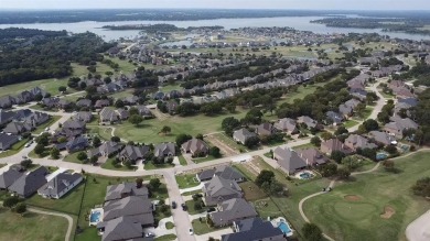 Elegant residence located at the first hole of the golf course on The Golf Club at Resort Eagle Mountain Lake in Texas - for sale on GolfHomes.com, golf home, golf lot