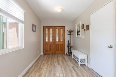 Welcome to a beautifully maintained single-level home nestled on on Mile Square Golf Course in California - for sale on GolfHomes.com, golf home, golf lot