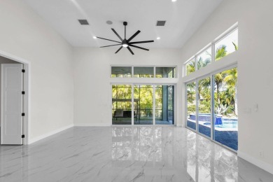Complete modern remodeling. New Roof with 3 solar fans, Full on Heron Bay Golf Club in Florida - for sale on GolfHomes.com, golf home, golf lot