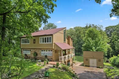 Nestled on the tranquil shores of a private lake, this elegant on Foxcliff Golf Club in Indiana - for sale on GolfHomes.com, golf home, golf lot