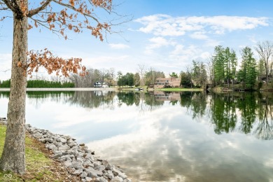 Nestled on the tranquil shores of a private lake, this elegant on Foxcliff Golf Club in Indiana - for sale on GolfHomes.com, golf home, golf lot