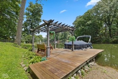 Nestled on the tranquil shores of a private lake, this elegant on Foxcliff Golf Club in Indiana - for sale on GolfHomes.com, golf home, golf lot