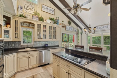 Nestled on the tranquil shores of a private lake, this elegant on Foxcliff Golf Club in Indiana - for sale on GolfHomes.com, golf home, golf lot