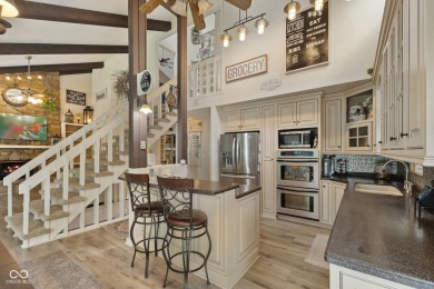 Nestled on the tranquil shores of a private lake, this elegant on Foxcliff Golf Club in Indiana - for sale on GolfHomes.com, golf home, golf lot