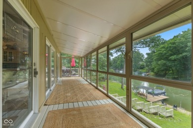 Nestled on the tranquil shores of a private lake, this elegant on Foxcliff Golf Club in Indiana - for sale on GolfHomes.com, golf home, golf lot