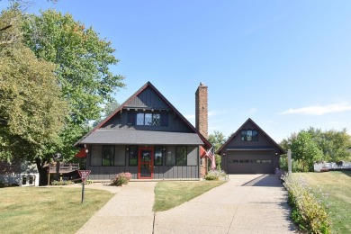 Chalet-style charm meets scenic beauty in this 3-bedroom, 2-bath on River Ridge Golf Club in Iowa - for sale on GolfHomes.com, golf home, golf lot