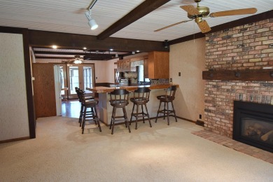 Chalet-style charm meets scenic beauty in this 3-bedroom, 2-bath on River Ridge Golf Club in Iowa - for sale on GolfHomes.com, golf home, golf lot