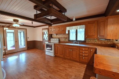 Chalet-style charm meets scenic beauty in this 3-bedroom, 2-bath on River Ridge Golf Club in Iowa - for sale on GolfHomes.com, golf home, golf lot