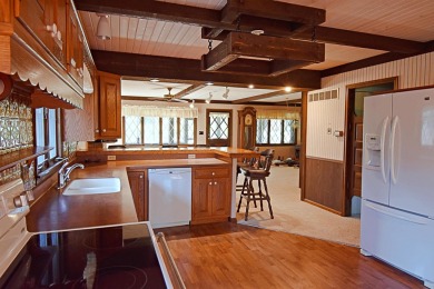 Chalet-style charm meets scenic beauty in this 3-bedroom, 2-bath on River Ridge Golf Club in Iowa - for sale on GolfHomes.com, golf home, golf lot