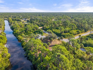 Build your dream home on this beautiful waterfront lot in a on Sabal Trace Golf and Country Club in Florida - for sale on GolfHomes.com, golf home, golf lot