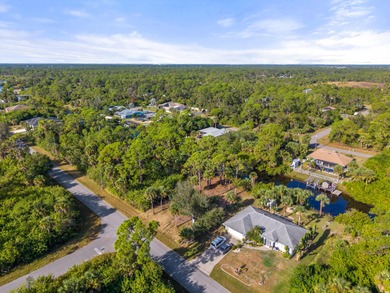 Build your dream home on this beautiful waterfront lot in a on Sabal Trace Golf and Country Club in Florida - for sale on GolfHomes.com, golf home, golf lot