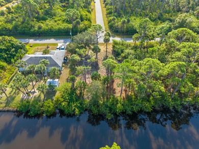 Build your dream home on this beautiful waterfront lot in a on Sabal Trace Golf and Country Club in Florida - for sale on GolfHomes.com, golf home, golf lot