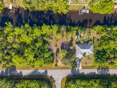 Build your dream home on this beautiful waterfront lot in a on Sabal Trace Golf and Country Club in Florida - for sale on GolfHomes.com, golf home, golf lot