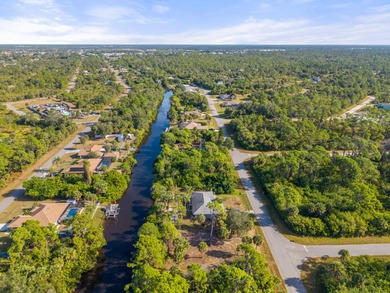 Build your dream home on this beautiful waterfront lot in a on Sabal Trace Golf and Country Club in Florida - for sale on GolfHomes.com, golf home, golf lot
