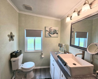 This home is located on leased land in a 55+ resort-style MH on Big Cypress Golf and Country Club in Florida - for sale on GolfHomes.com, golf home, golf lot