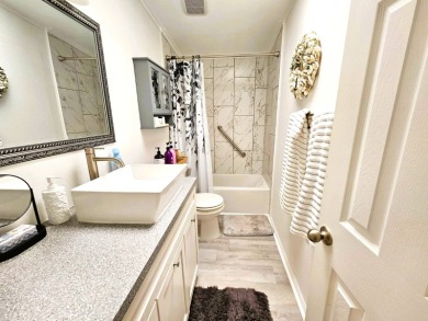 This home is located on leased land in a 55+ resort-style MH on Big Cypress Golf and Country Club in Florida - for sale on GolfHomes.com, golf home, golf lot