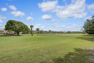 Corner first-floor unit with breathtaking golf course views! on The Golf Club of Jupiter in Florida - for sale on GolfHomes.com, golf home, golf lot