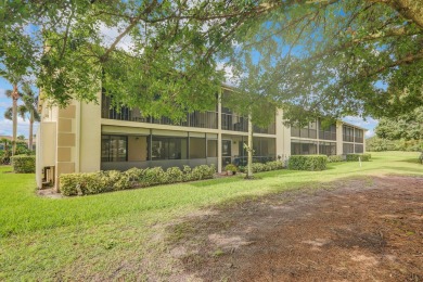 Corner first-floor unit with breathtaking golf course views! on The Golf Club of Jupiter in Florida - for sale on GolfHomes.com, golf home, golf lot