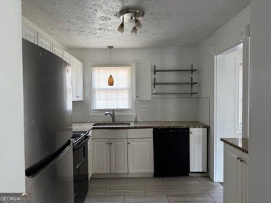 East Atlanta Deal:  This four side brick single family house was on East Lake Golf Club in Georgia - for sale on GolfHomes.com, golf home, golf lot
