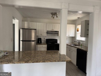 East Atlanta Deal:  This four side brick single family house was on East Lake Golf Club in Georgia - for sale on GolfHomes.com, golf home, golf lot