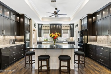 This amazing Mediterranean style home on the Egret 6th tee box on Carolina National Golf Club in North Carolina - for sale on GolfHomes.com, golf home, golf lot