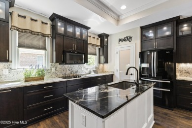 This amazing Mediterranean style home on the Egret 6th tee box on Carolina National Golf Club in North Carolina - for sale on GolfHomes.com, golf home, golf lot