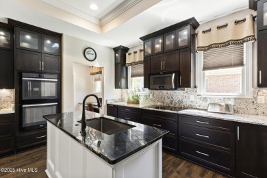 This amazing Mediterranean style home on the Egret 6th tee box on Carolina National Golf Club in North Carolina - for sale on GolfHomes.com, golf home, golf lot