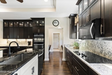 This amazing Mediterranean style home on the Egret 6th tee box on Carolina National Golf Club in North Carolina - for sale on GolfHomes.com, golf home, golf lot