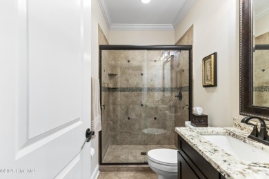 This amazing Mediterranean style home on the Egret 6th tee box on Carolina National Golf Club in North Carolina - for sale on GolfHomes.com, golf home, golf lot