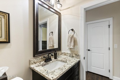 This amazing Mediterranean style home on the Egret 6th tee box on Carolina National Golf Club in North Carolina - for sale on GolfHomes.com, golf home, golf lot
