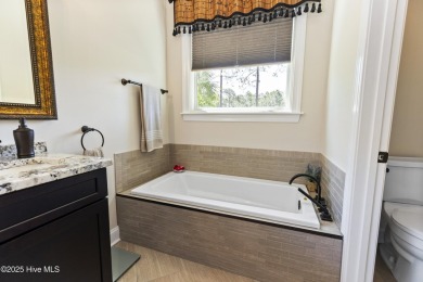 This amazing Mediterranean style home on the Egret 6th tee box on Carolina National Golf Club in North Carolina - for sale on GolfHomes.com, golf home, golf lot