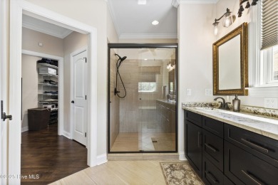 This amazing Mediterranean style home on the Egret 6th tee box on Carolina National Golf Club in North Carolina - for sale on GolfHomes.com, golf home, golf lot