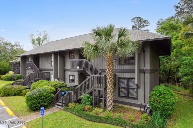 This peaceful 2 bedroom 2 bath retreat overlooking lush greenery on Diamondhead Country Club in Mississippi - for sale on GolfHomes.com, golf home, golf lot