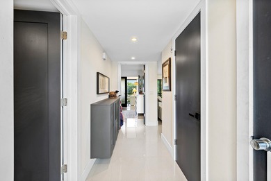 Beautifully updated 2nd-floor residence featuring bold color on Quail Ridge Golf Course and Country Club in Florida - for sale on GolfHomes.com, golf home, golf lot