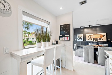Beautifully updated 2nd-floor residence featuring bold color on Quail Ridge Golf Course and Country Club in Florida - for sale on GolfHomes.com, golf home, golf lot